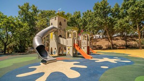 A playground with a slide and climbing structures. - Stunning home in Marbella with WiFi (Marbella)