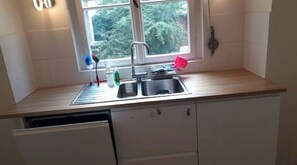 Fridge, dishwasher, electric kettle, cookware/dishes/utensils