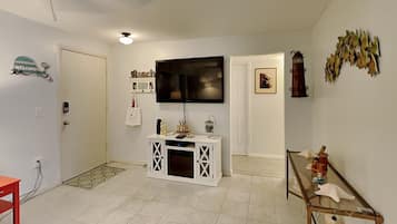 Condo, Multiple Beds, Patio, Pool View | Living area | Flat-screen TV, fireplace