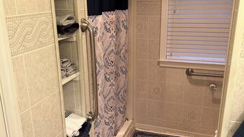 Shower, hair dryer, towels, toilet paper