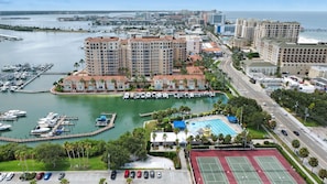 Stunning marina views surround this coastal retreat, offering a tennis court and pool.
