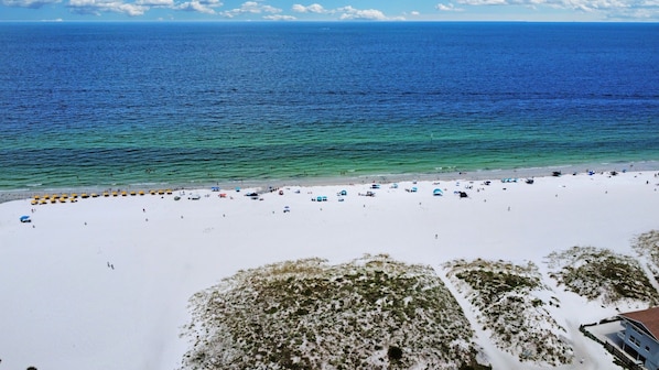 Enjoy the serene beach views and relax on the resort's sun loungers.