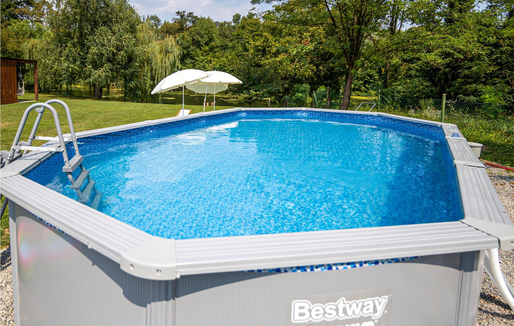 An above-ground swimming pool with a ladder and a Bestway logo.