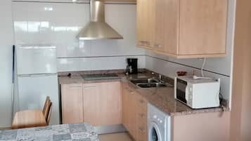 Fridge, microwave, coffee/tea maker, toaster