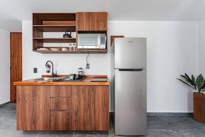 Fridge, microwave, stovetop, coffee/tea maker