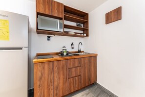 Fridge, microwave, stovetop, coffee/tea maker