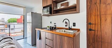 Fridge, microwave, stovetop, coffee/tea maker