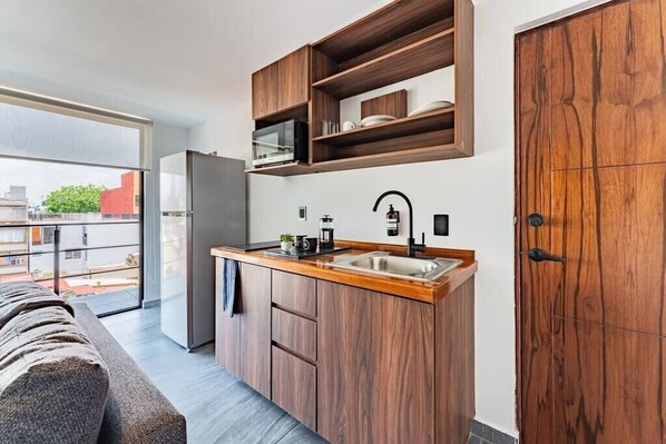 Fridge, microwave, stovetop, coffee/tea maker