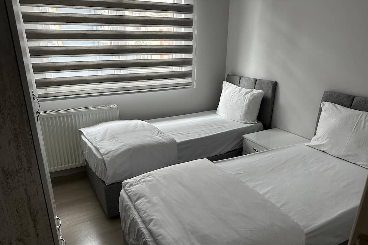 Family Apartment | Desk, iron/ironing board (on request), WiFi (free), bed sheets