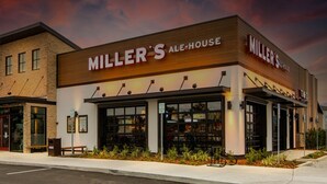 A Miller's Ale House storefront with a brick facade, large windows, and outdoor seating area. - 3BR retreat w/ private fence yard • 16 min to Siesta Key (Sarasota)