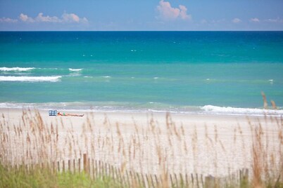 Private cottage at the end of the road with hot tub, swim mat, kayaks, and a your private dock, 3 miles to the beach.