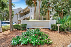 A sign for Tanglewood Villas with a landscaped garden in front. - 302 Tanglewood Villa (Hilton Head Island)