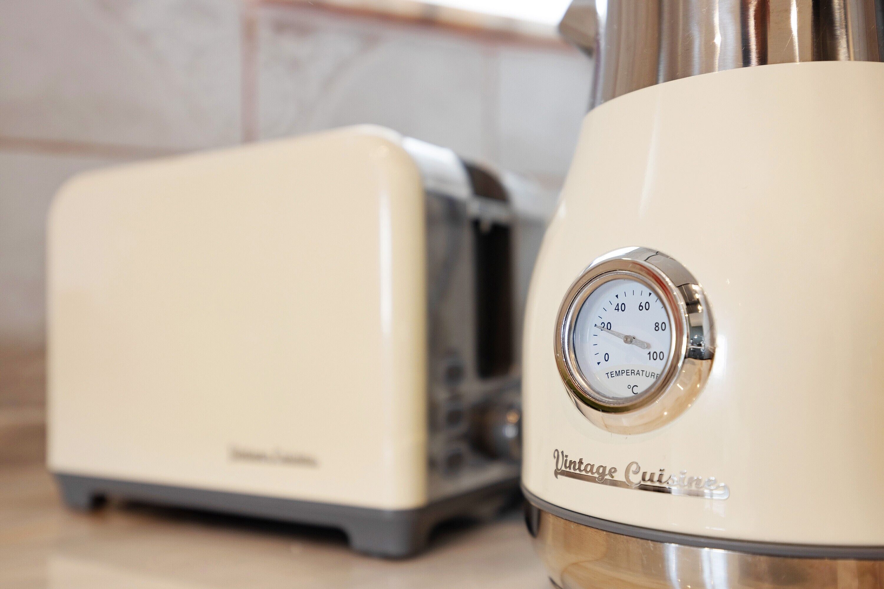 A vintage-style kitchen with a toaster and a coffee maker.