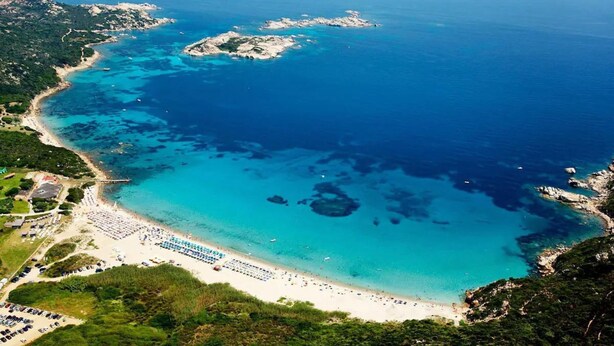 An aerial view of a coastal area with a beach, boats, and a marina. - Holiday Apartment "La Rosa dei Venti" with Sea View, Shared Pool & Private Terrace (Santa Teresa Gallura)