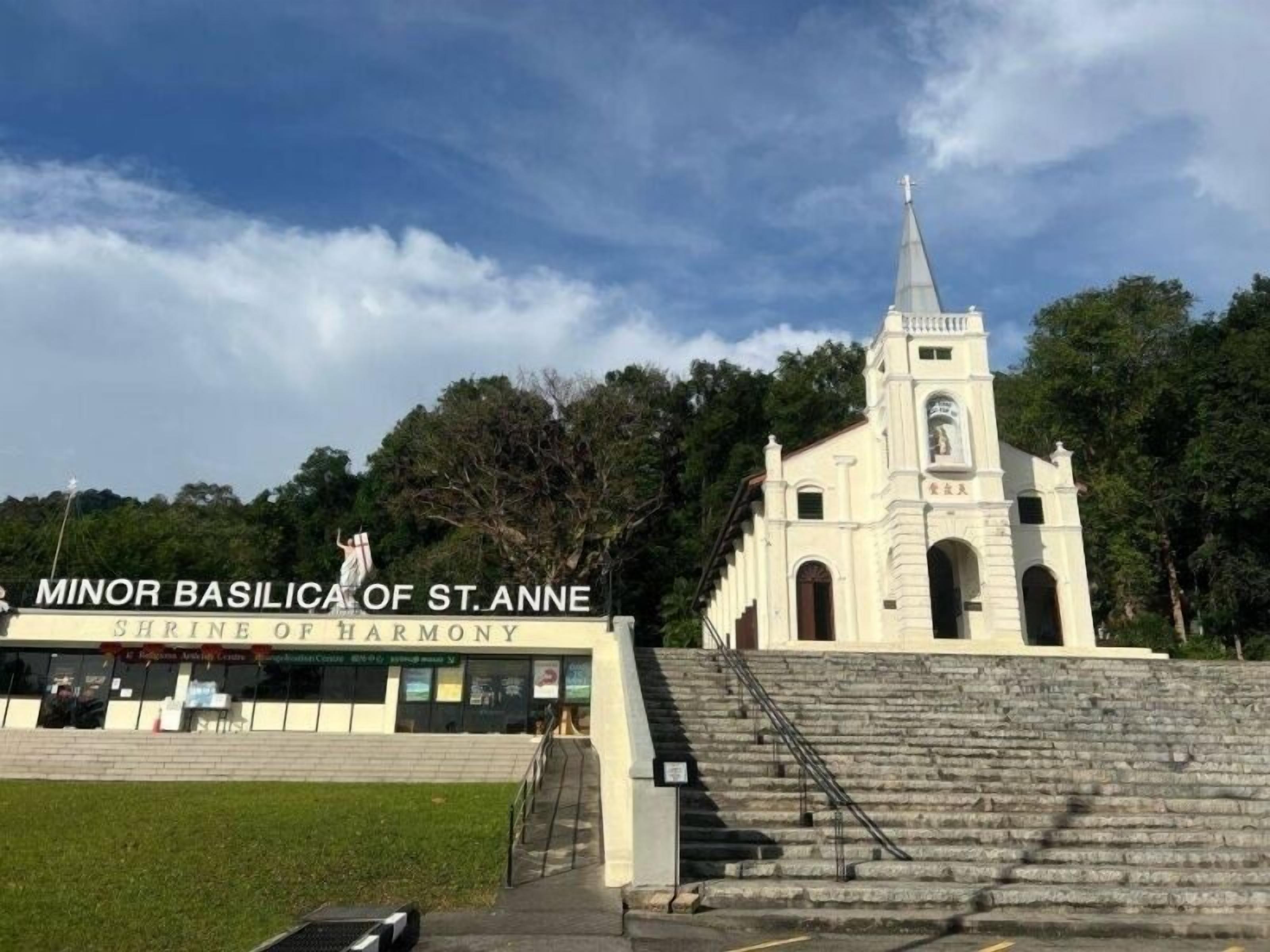 The Minor Basilica of St. Anne with a sign reading "Shrine of Harmony" and a staircase leading to the entrance.