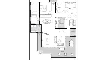 A floor plan of a hotel with a games room, dining area, kitchen, laundry/bathroom, and multiple bedrooms.