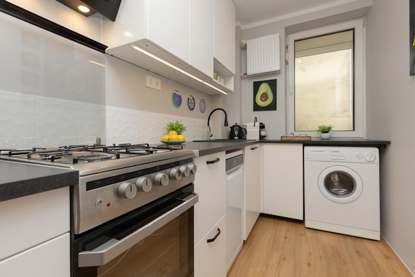 Apartment, 2 Bedrooms, Balcony | Private kitchen | Microwave, dishwasher, coffee/tea maker, cookware/dishes/utensils