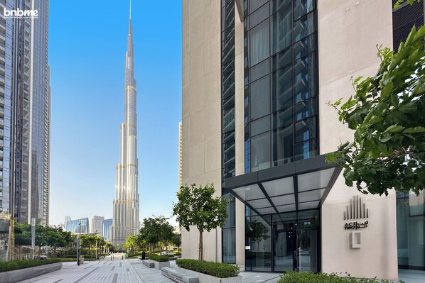 A modern building with a glass facade and a sign reading "ACLIFF TWO". - bnbme | Act One Act Two | 1 BDR (Dubai)