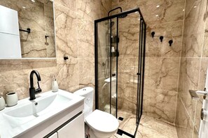 Shower, hair dryer, towels, soap