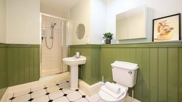 Bathtub, hair dryer, towels, soap