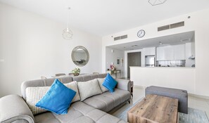 Deluxe Apartment | Living area | 50-inch Smart TV with cable channels, Netflix, streaming services