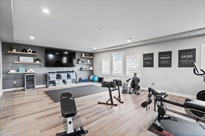 In Home Fitness Room - Workout Equipment, TV, Mini Fridge for Beverages, and Yoga Equipment