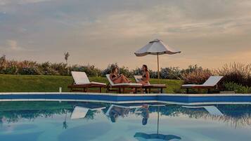 Outdoor pool, pool umbrellas, sun loungers