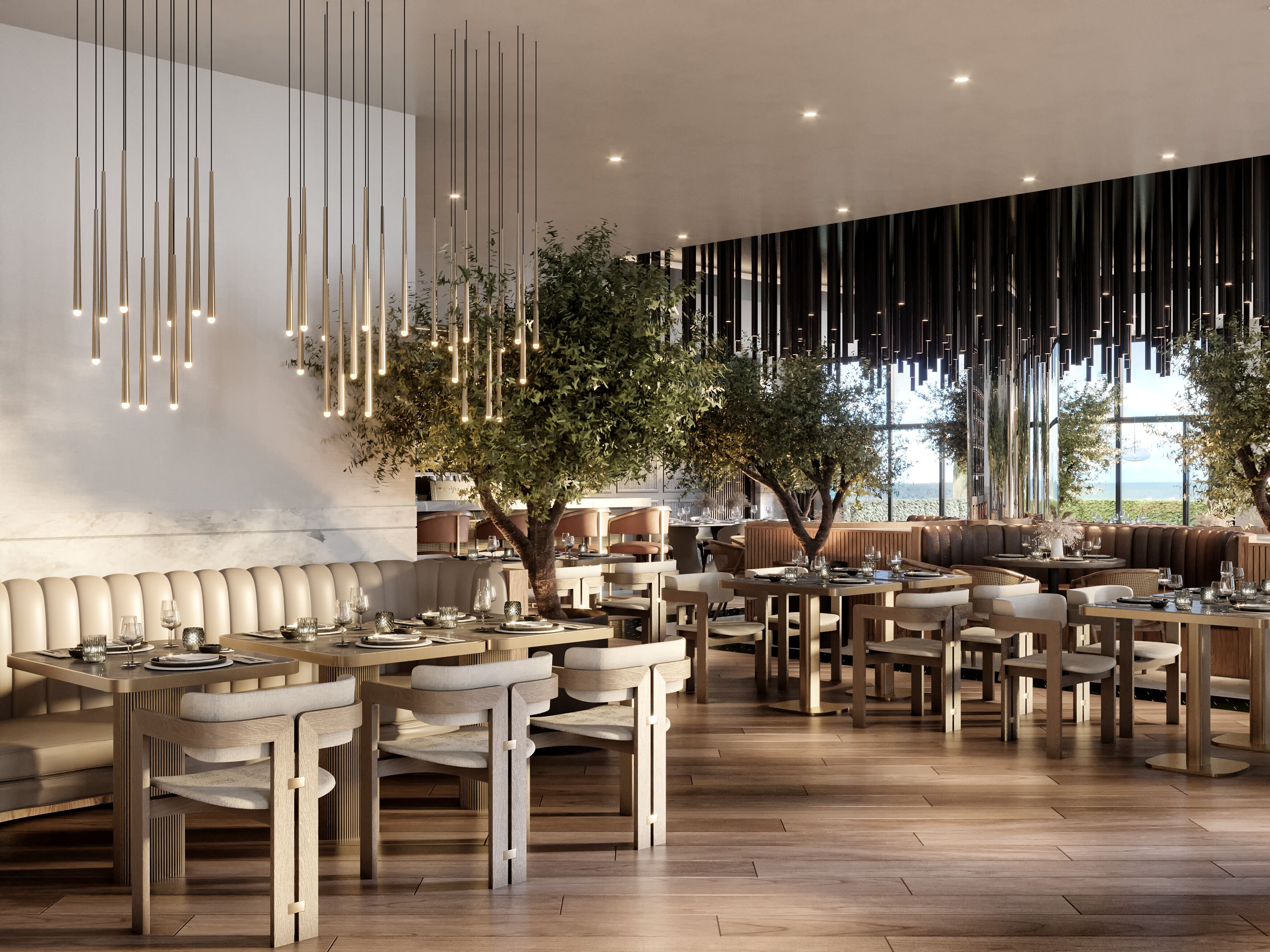 A modern restaurant interior with high tables and chairs, hanging light fixtures, and a large window overlooking a scenic view.
