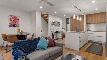 Luxury Townhome | Living area | Flat-screen TV