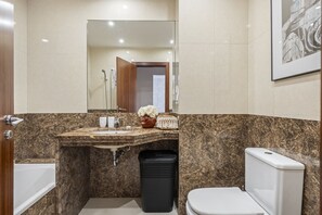 Bathtub, hair dryer, towels