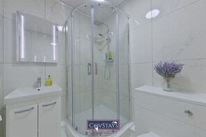 Shower, hair dryer, towels, soap