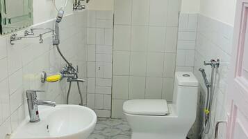 Shower, towels, soap, toilet paper