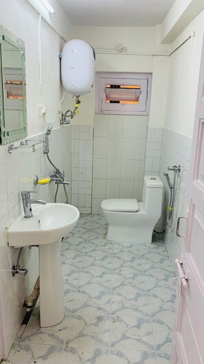 Shower, towels, soap, toilet paper