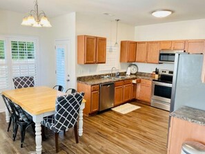 Enjoy cooking in this well-equipped kitchen with a dishwasher, oven, and microwave.