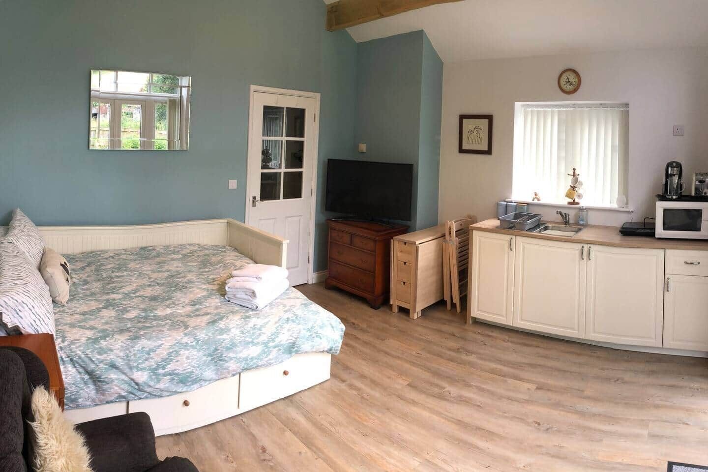 1 bedroom, desk, iron/ironing board, travel crib