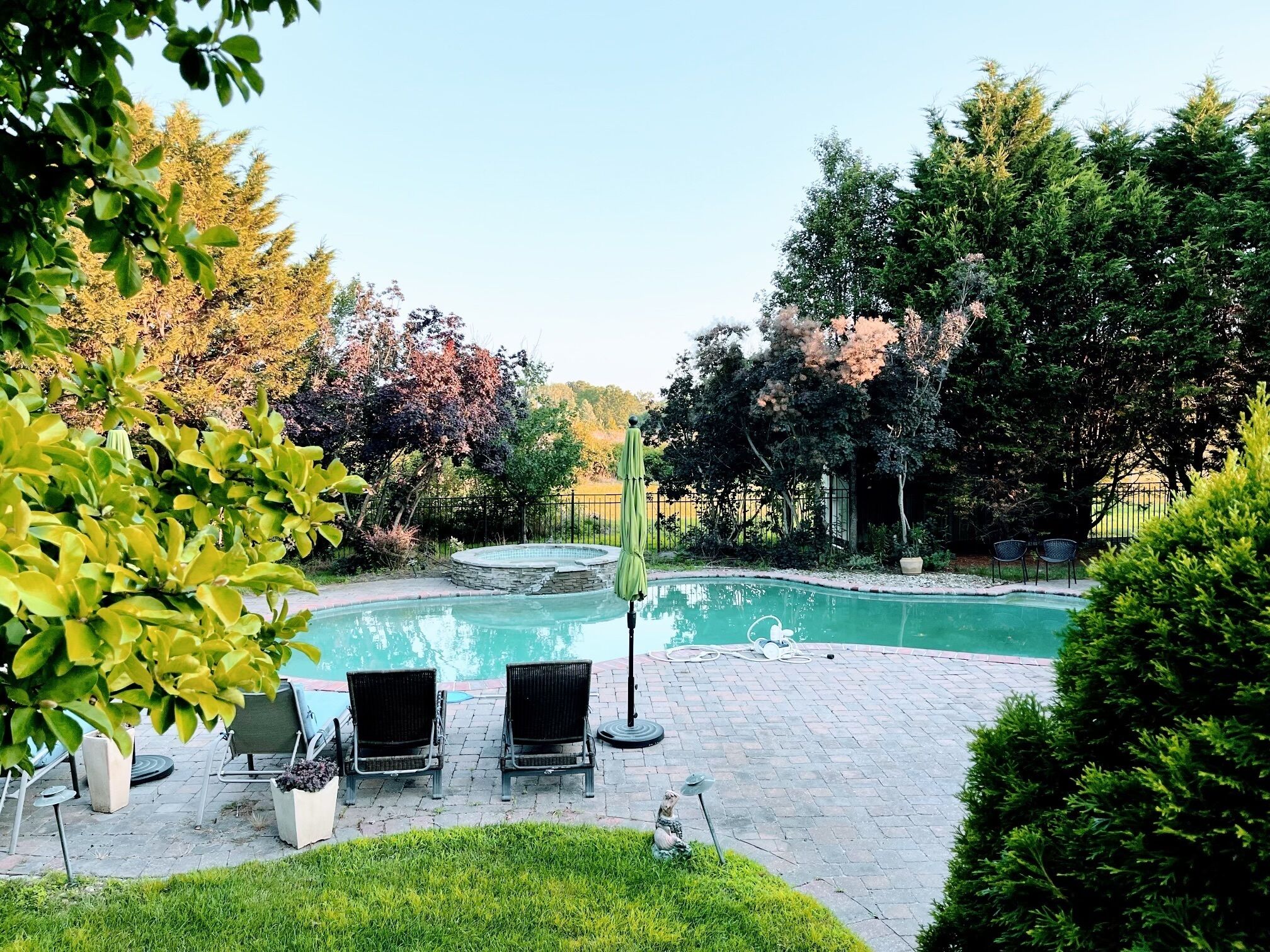 Comfortable, bright home with heated pool, deck, and yard.  