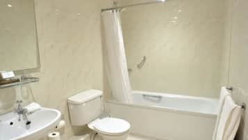 Un bagno moderno con lavandino, wc e vasca da bagno.