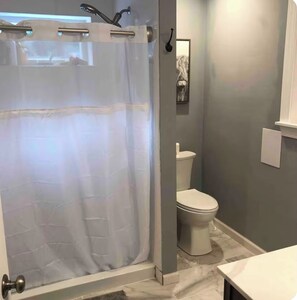 Shower, hair dryer, towels, soap