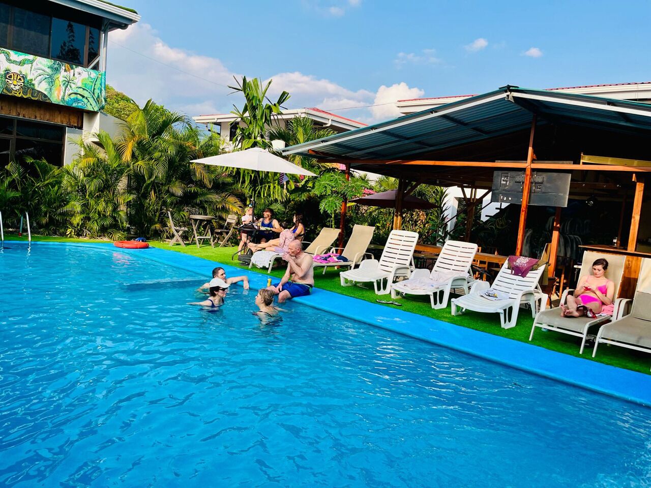 Outdoor pool, open 7:00 AM to 10:00 PM, pool umbrellas