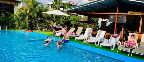 Outdoor pool, open 7:00 AM to 10:00 PM, pool umbrellas