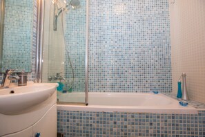 Bathtub, hair dryer, towels
