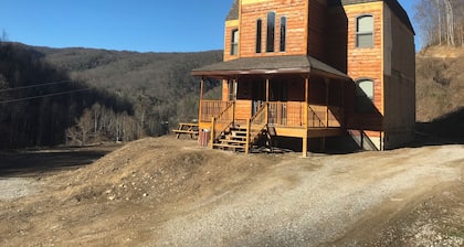4BR 2 bath house with full kitchen, living room, hot tub and game room.