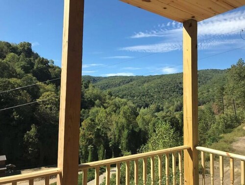 4BR 2 bath house with full kitchen, living room, hot tub and game room.