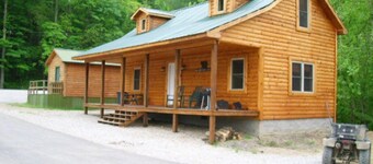 3BR, 1 Bath Cabin with hot tub, full kitchen, and living room.