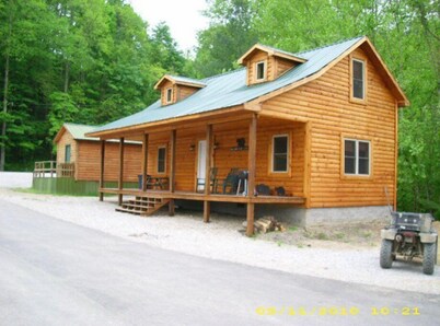 3BR, 1 Bath Cabin with hot tub, full kitchen, and living room.