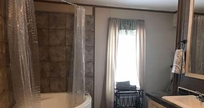 3BR, 2 Bath house with full kitchen, living room, and hot tub.