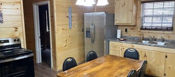 2BR 1 Bath cabin w/ full kitchen, hot tub, and living room.