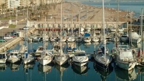 A marina with numerous boats docked, surrounded by buildings and a clear view of the sea. - Villa GAN EDEN a gem in a privileged environment (Barx)