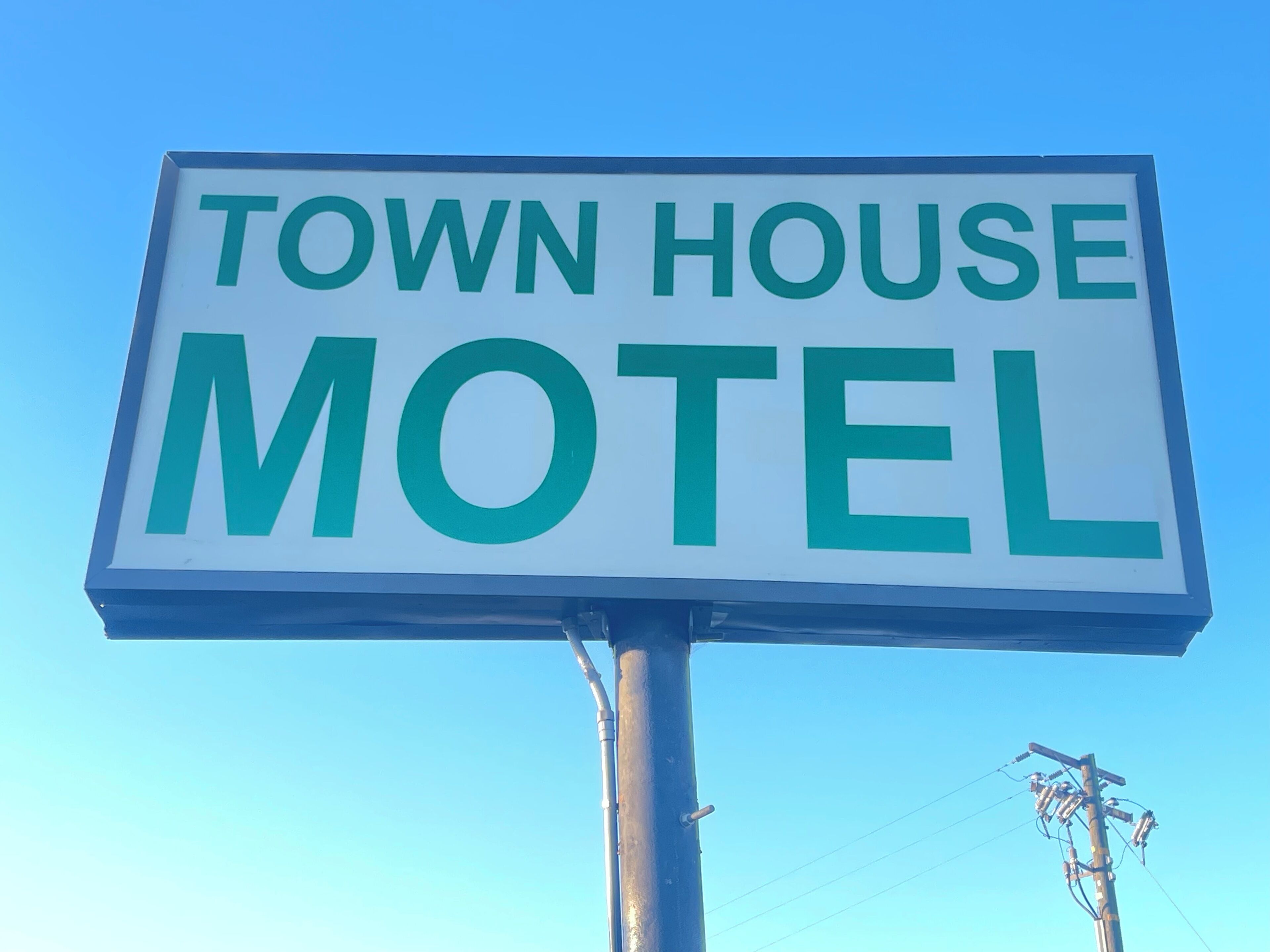 A sign for a Town House Motel.