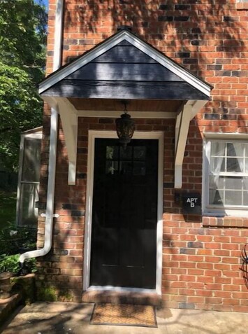 Private entrance with covered porch 